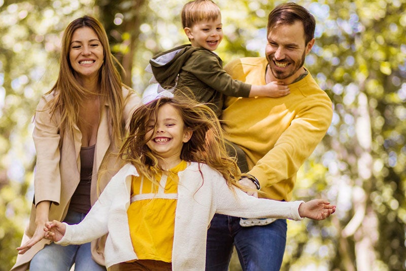 A wooden gavel rests on a round base on a blurred wooden table, representing justice and judgement.
